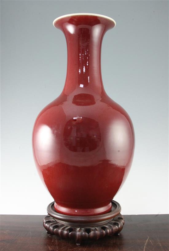 A large Chinese sang de boeuf glazed baluster vase, early 20th century, 50.5cm, wood stand, base drilled